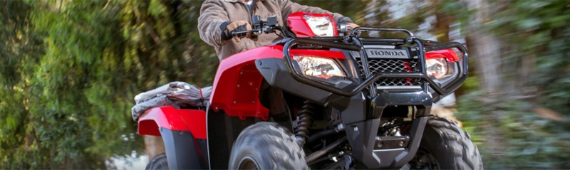 Man riding his repaired Honda 4 wheeler at I 69 Motorsports in Union City, TN